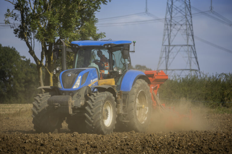 MRF Contracting tractor cultivating land beneath power lines